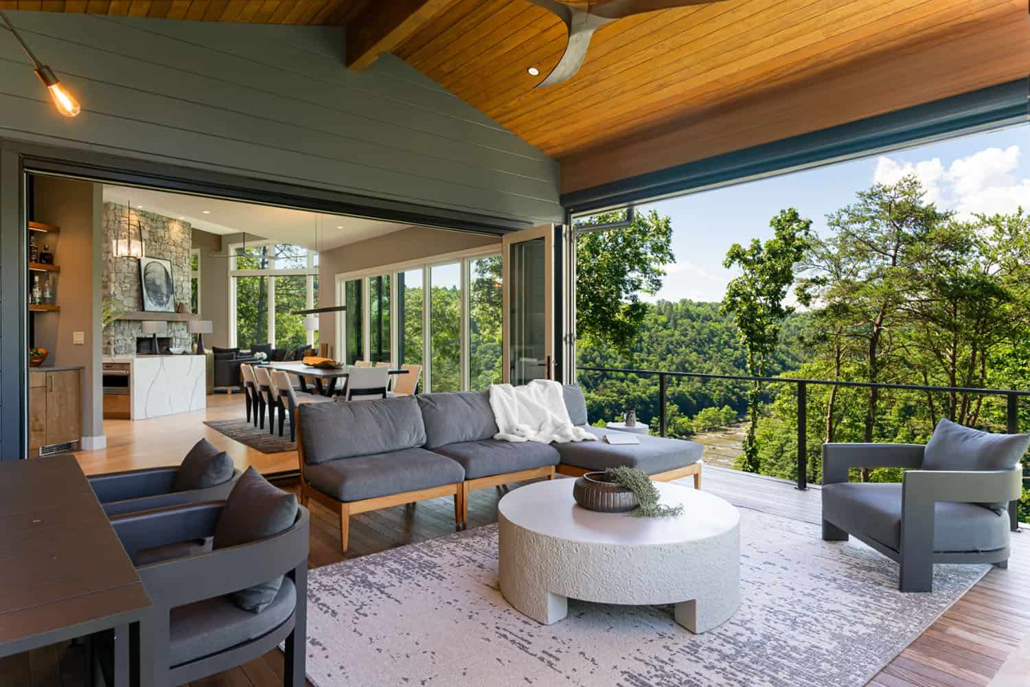 modern covered porch with outdoor furniture