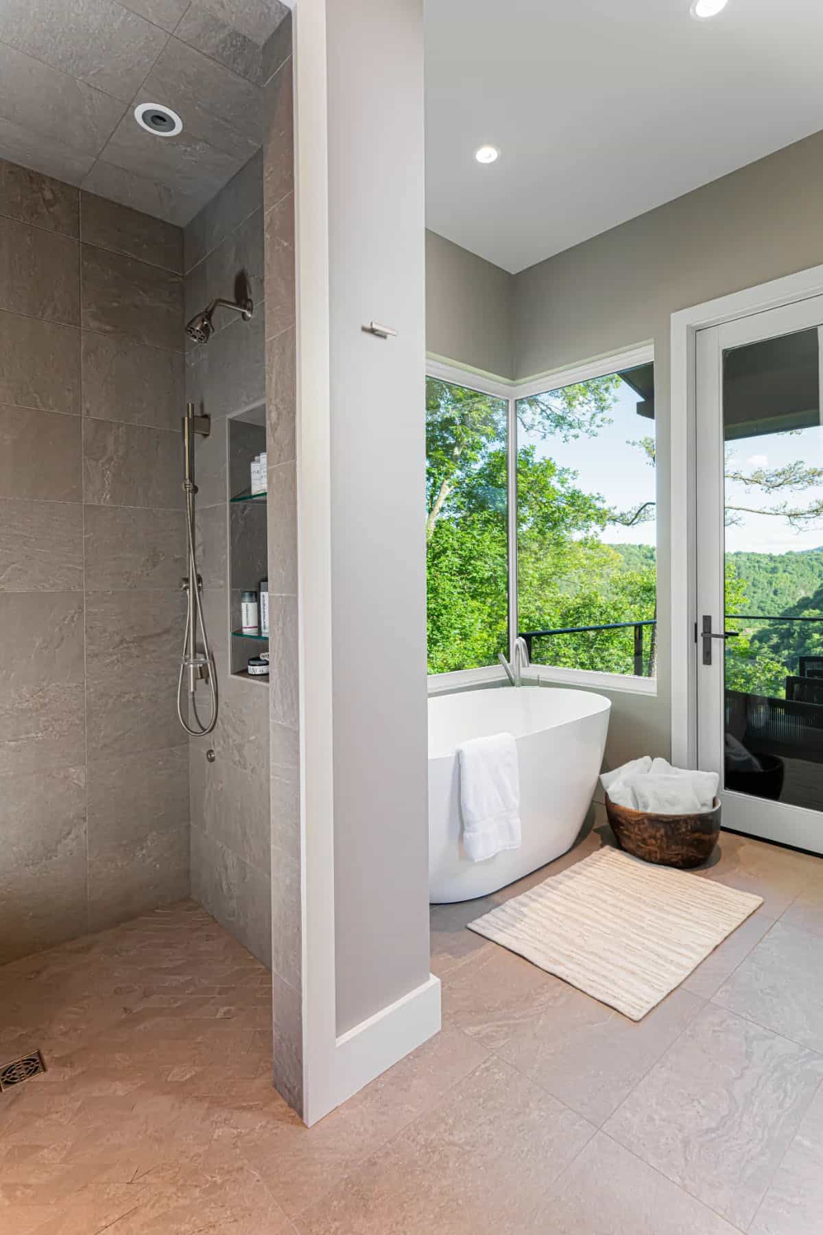 modern bathroom with a shower and freestanding tub