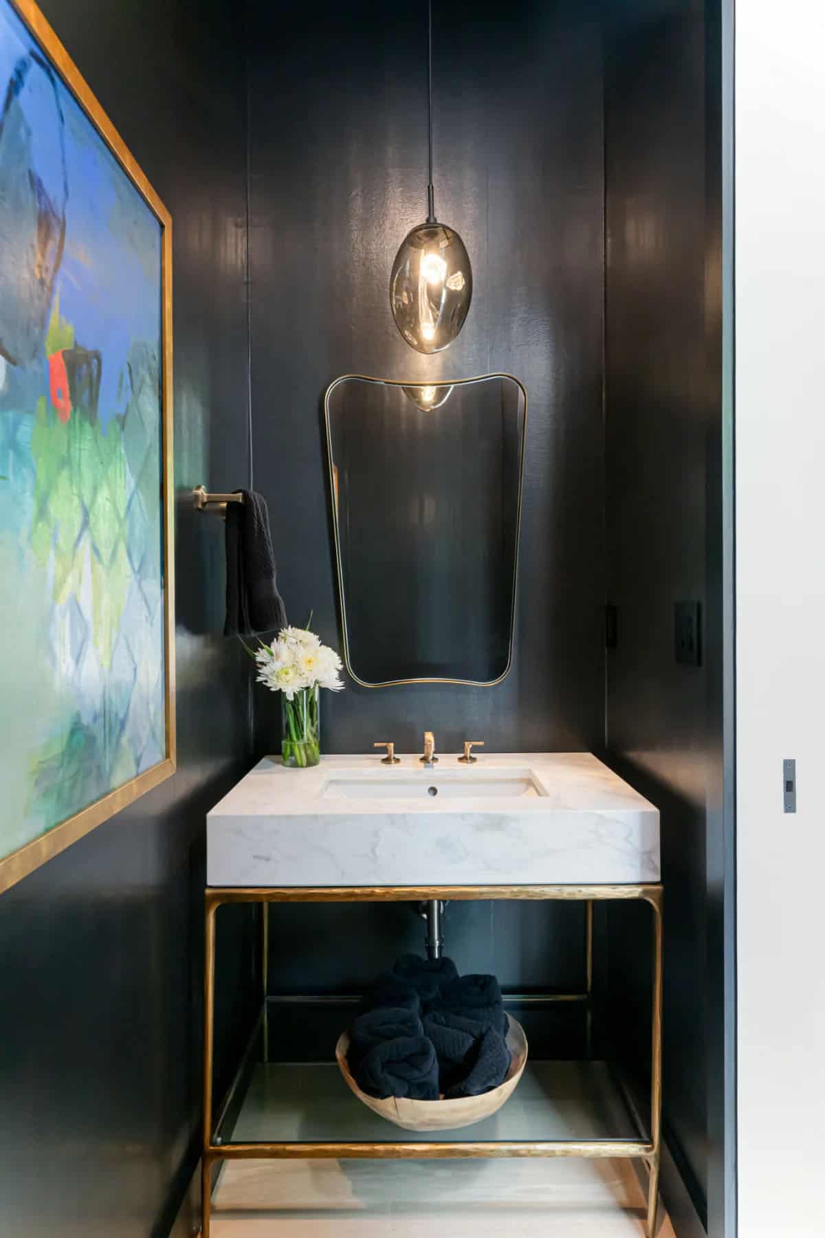 modern powder room with dark walls