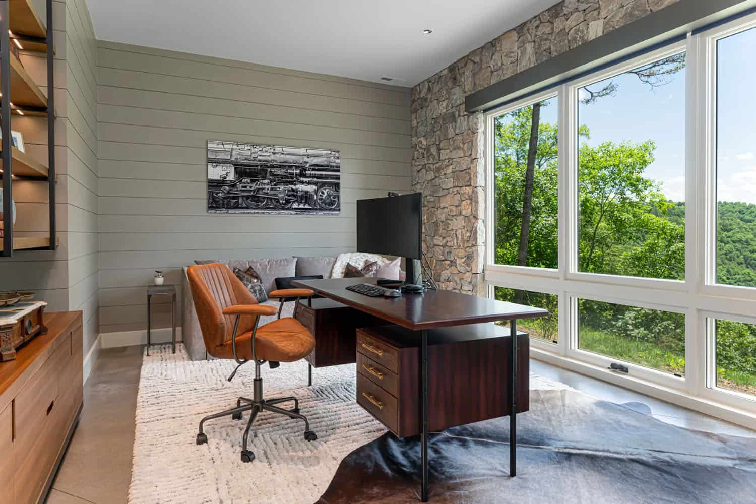 modern home office with a large window and a view