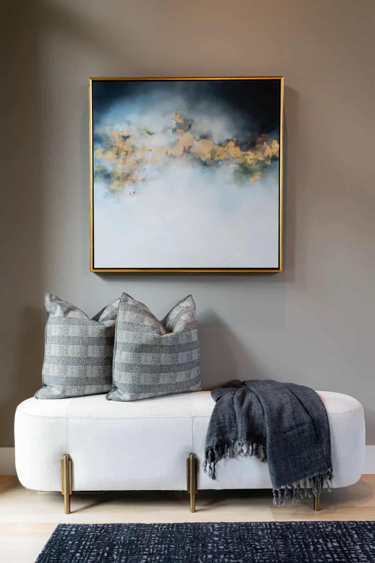 modern hallway with an upsholstered bench