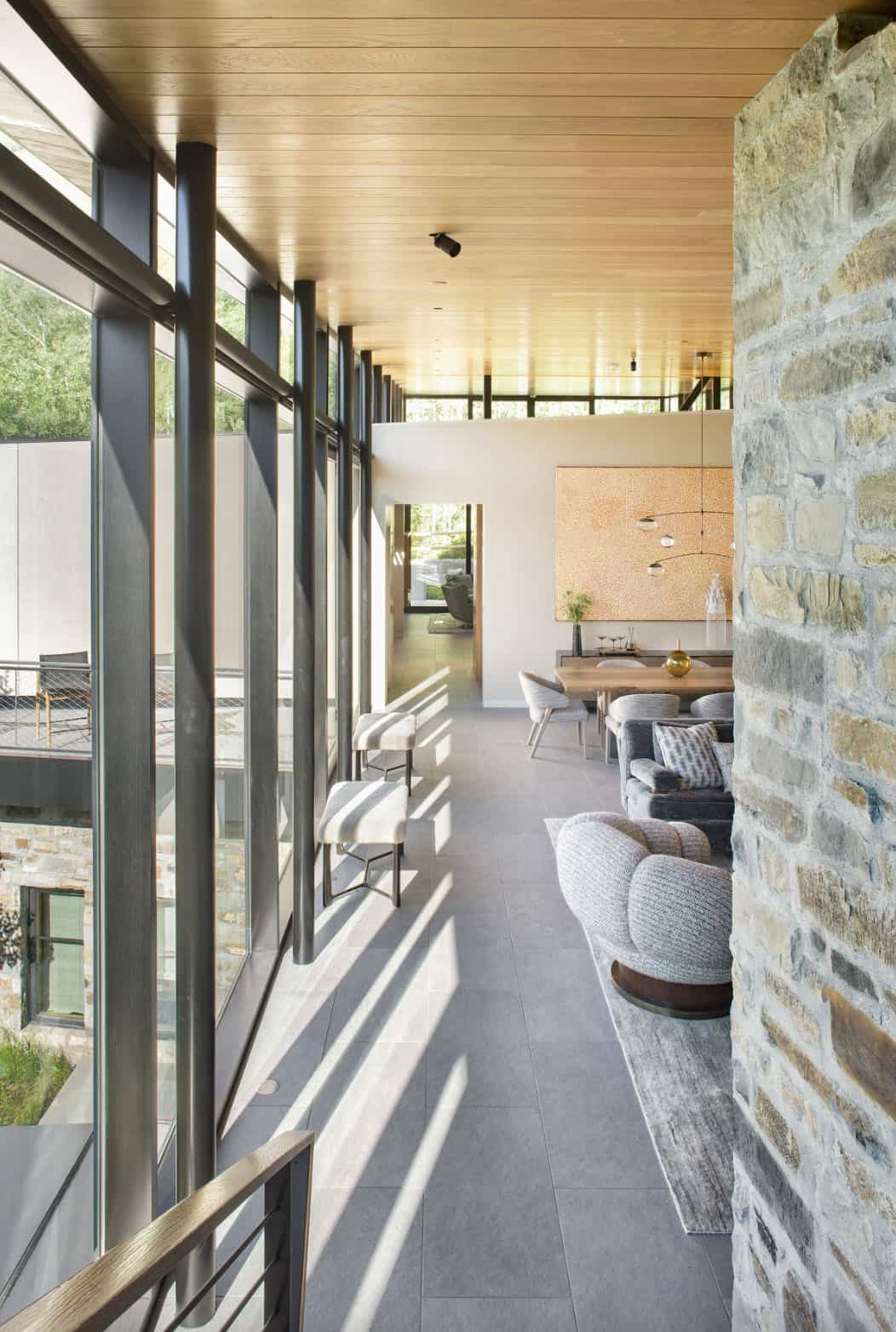 modern hallway with glass and stone walls