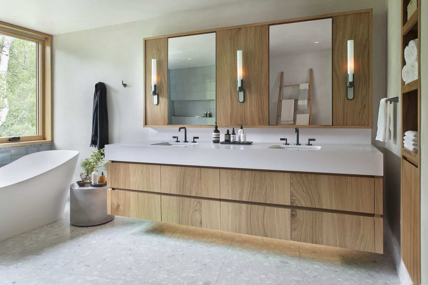 modern bathroom with a vanity and freestanding bath