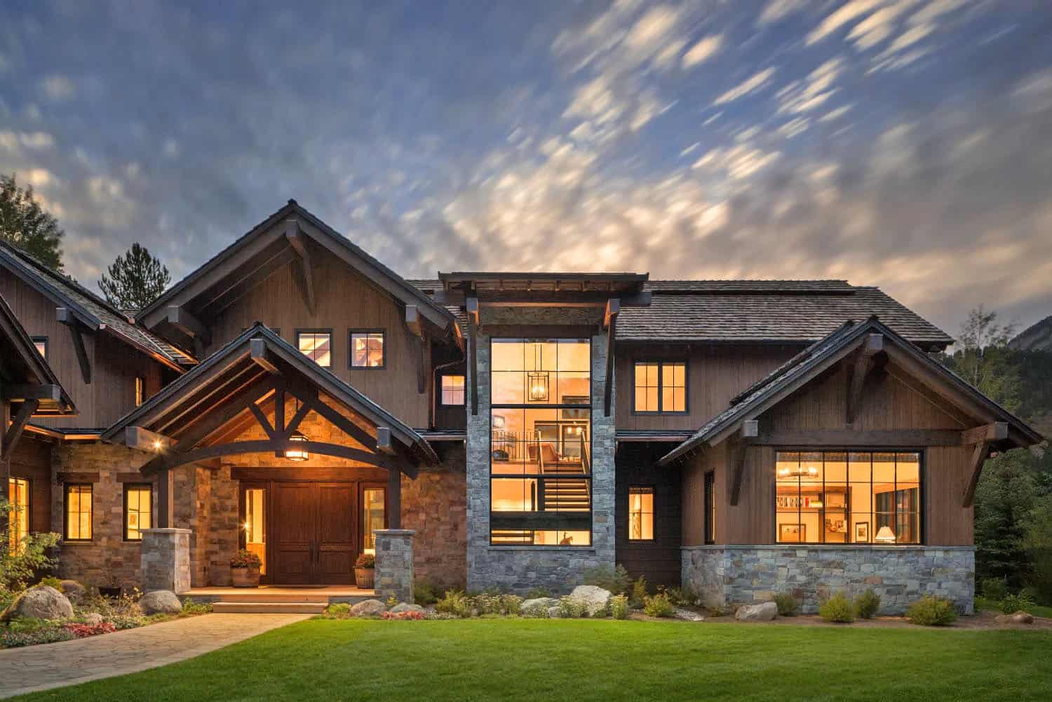 modern mountain home exterior at dusk