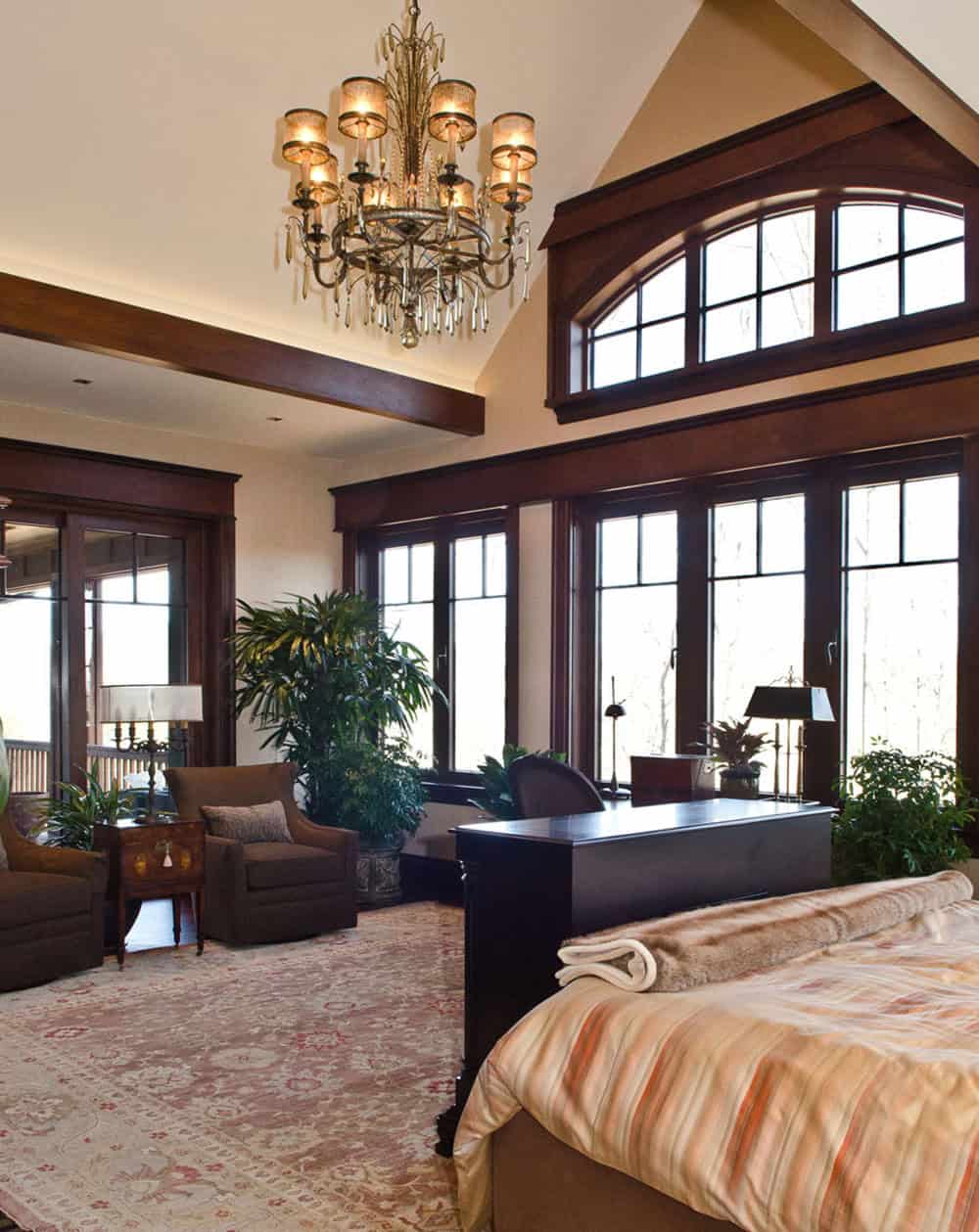 modern rustic mountain guest house bedroom with a pop-up television