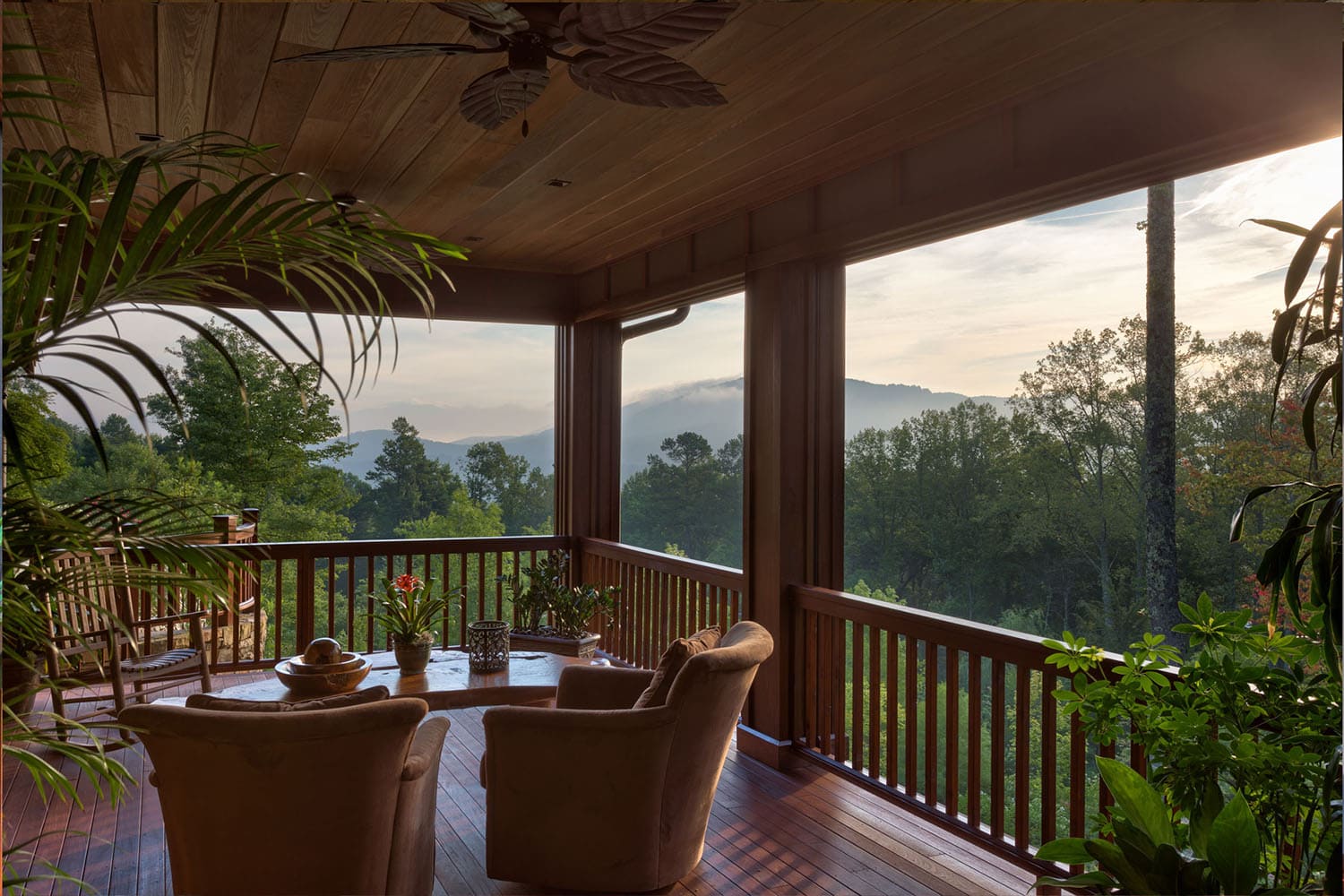 modern rustic mountain guest house with a covered patio and a view of the mountains