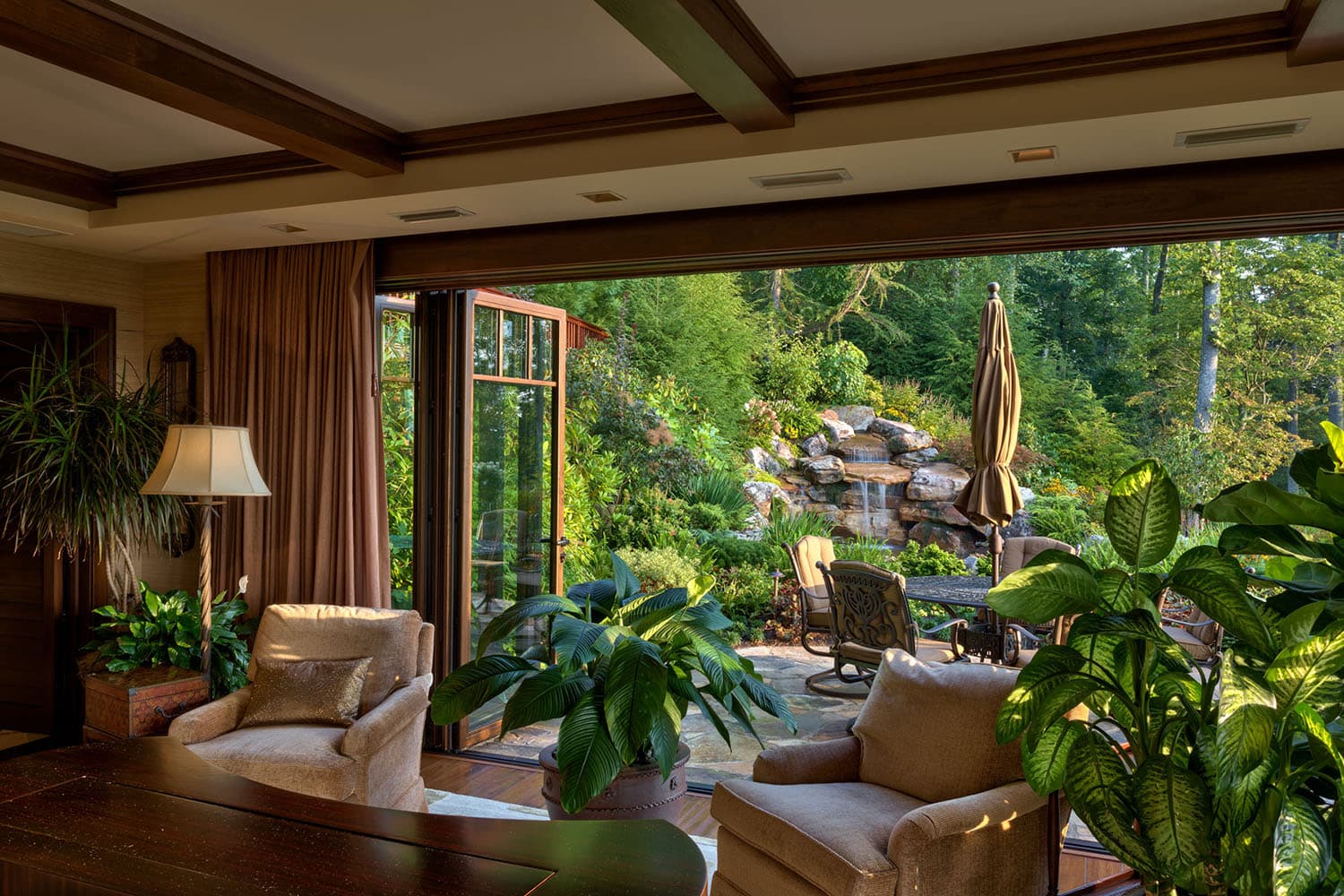 modern rustic mountain home with a view of the waterfall
