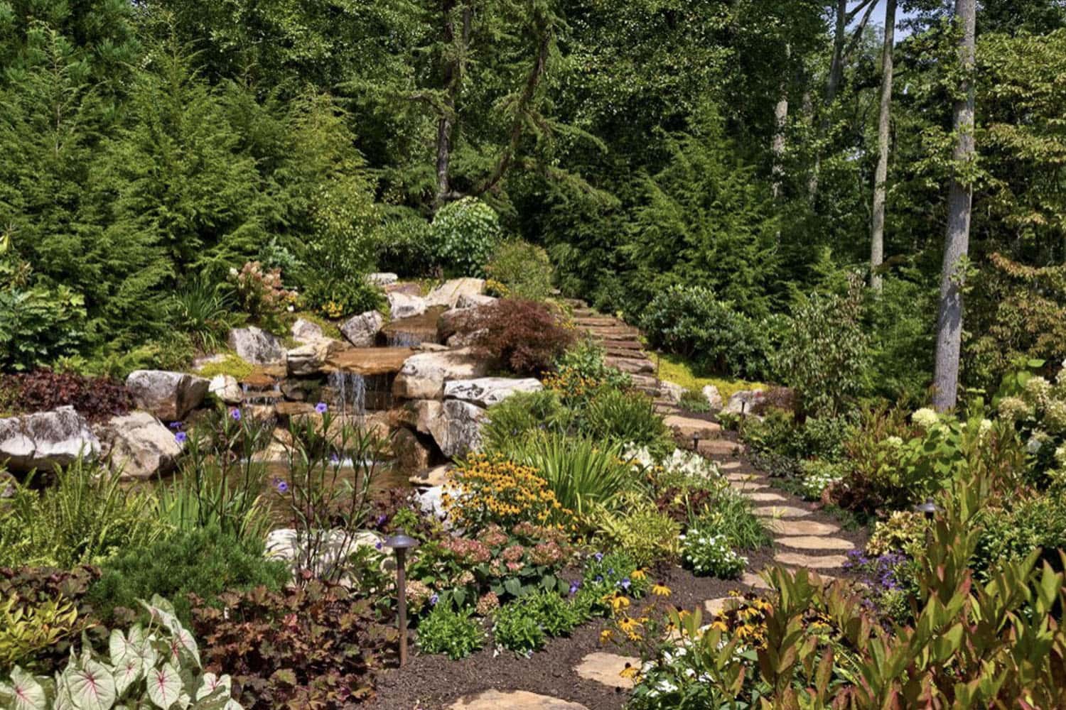 modern rustic mountain home exterior landscape with a pathway