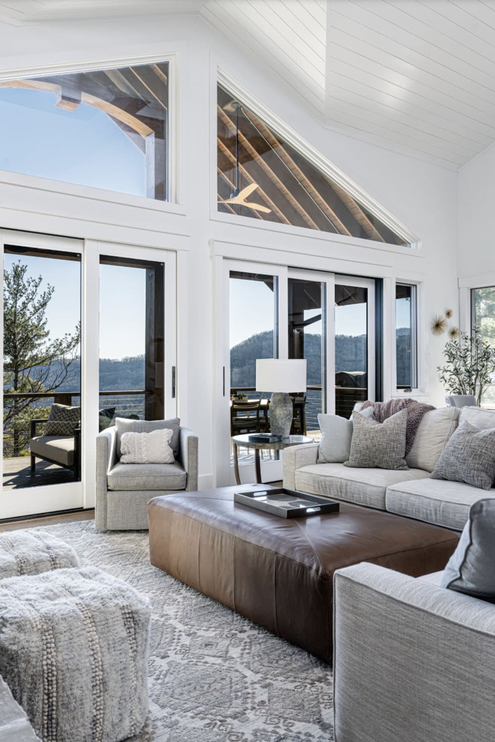 modern rustic living room with large windows