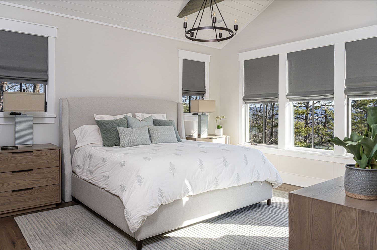 modern rustic bedroom with a chandelier