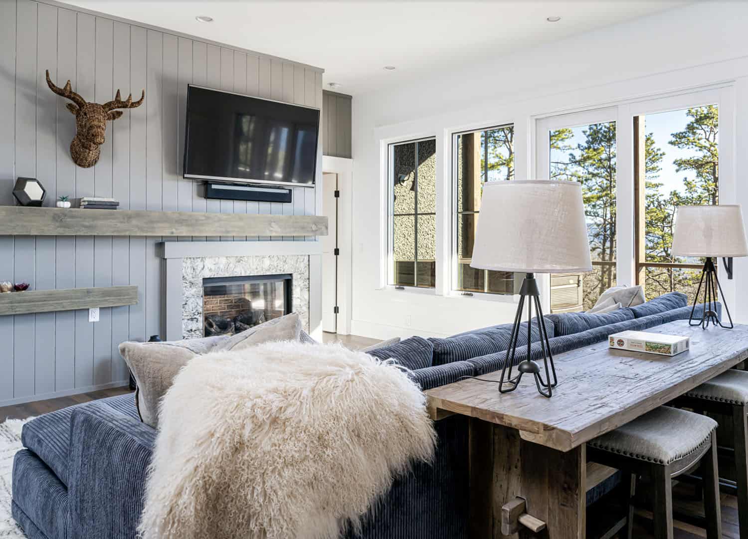 modern rustic family room with a fireplace