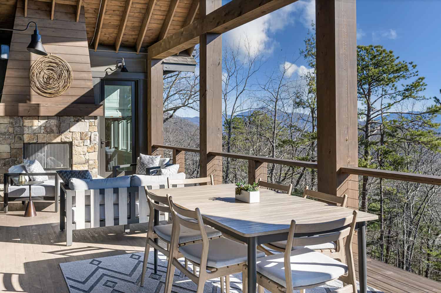 modern rustic mountain home exterior with a covered porch with alfresco dining