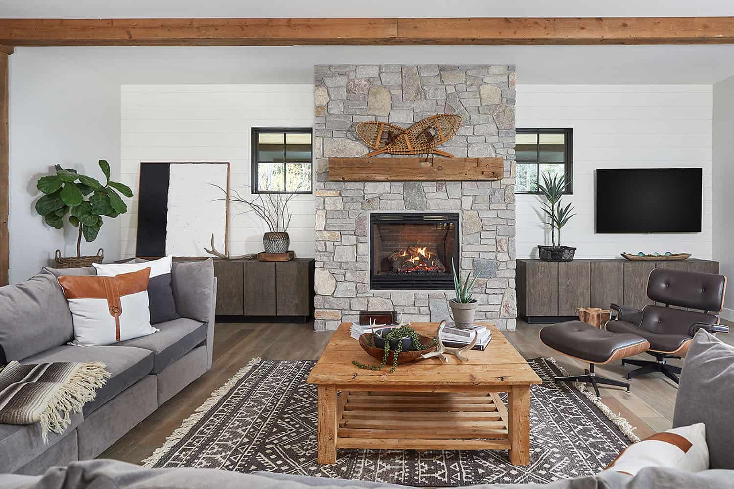 mountain style living room with a fireplace