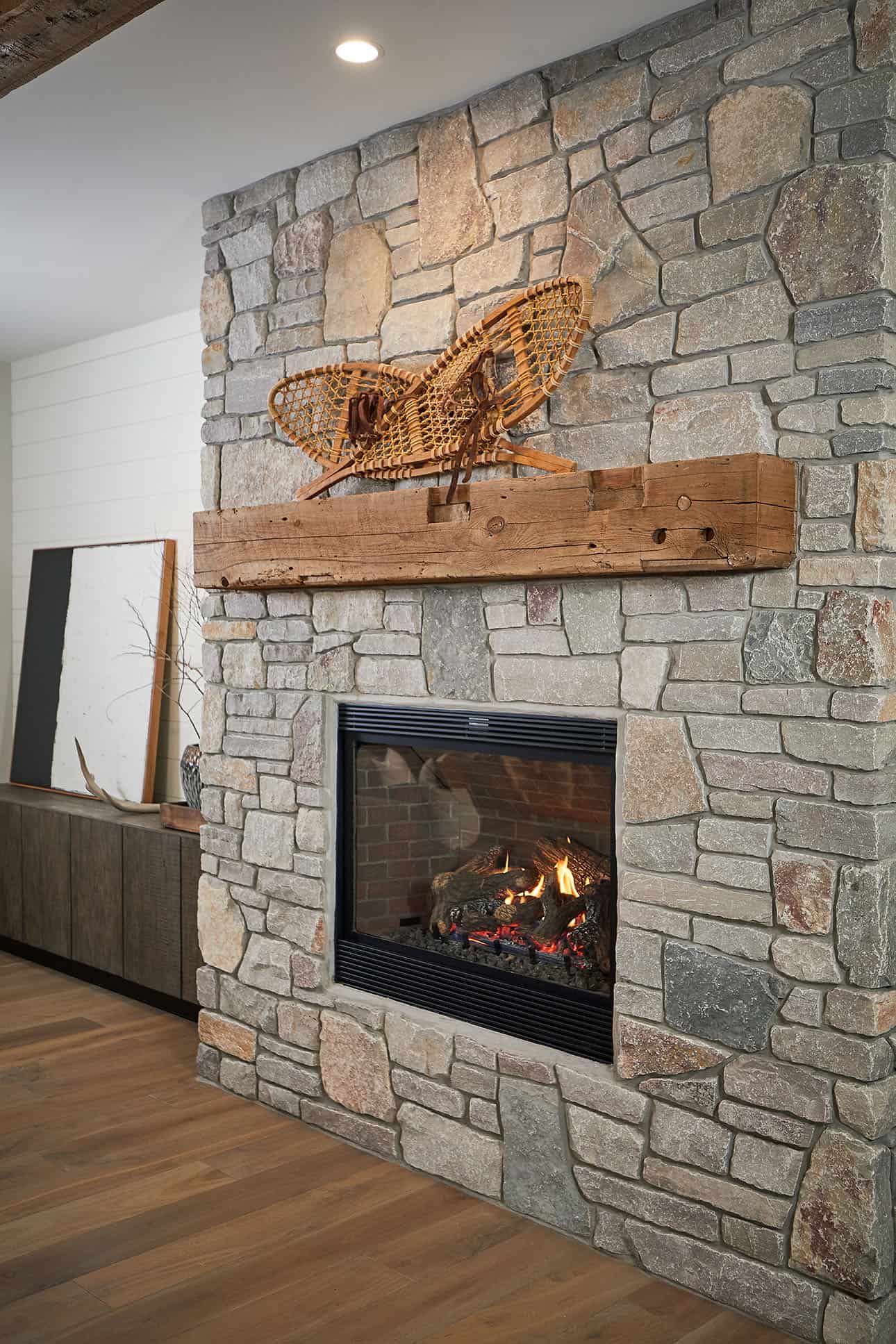 mountain style living room with a fireplace