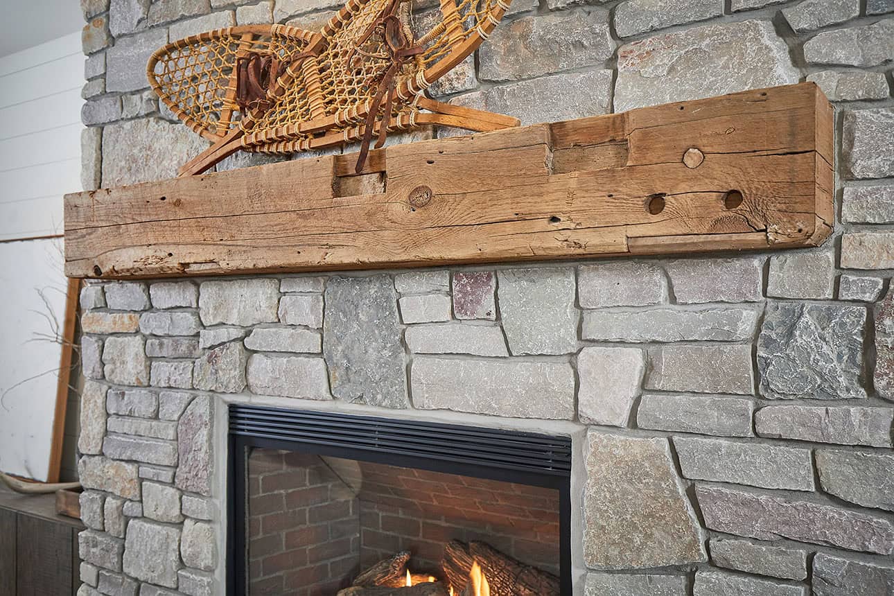 mountain style living room with a fireplace