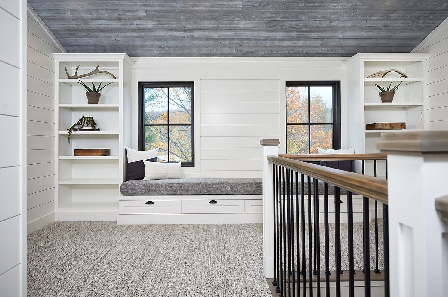 mountain style upstairs hallway with a built-in window seat