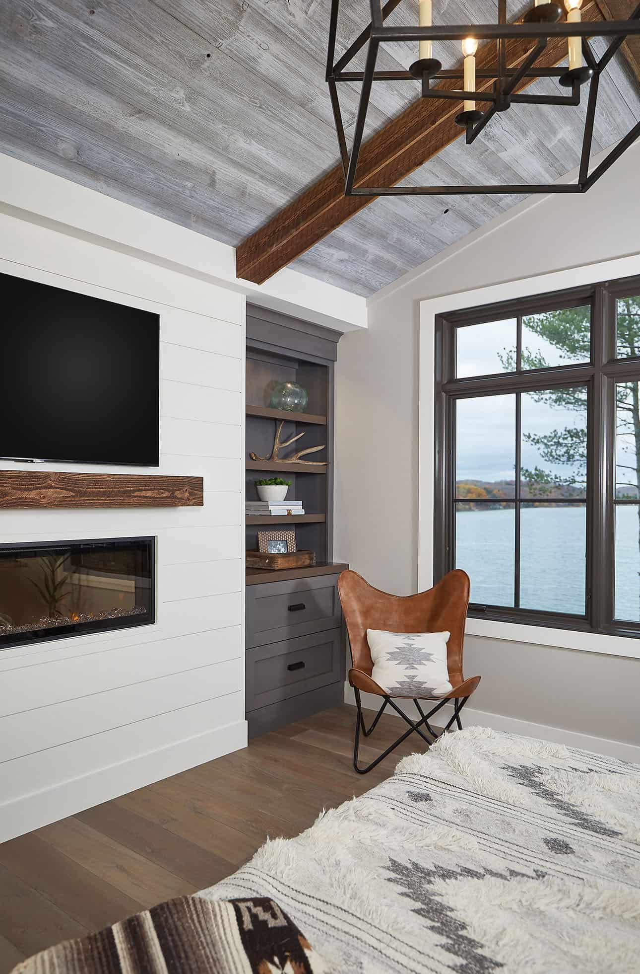 mountain style bedroom with a fireplace