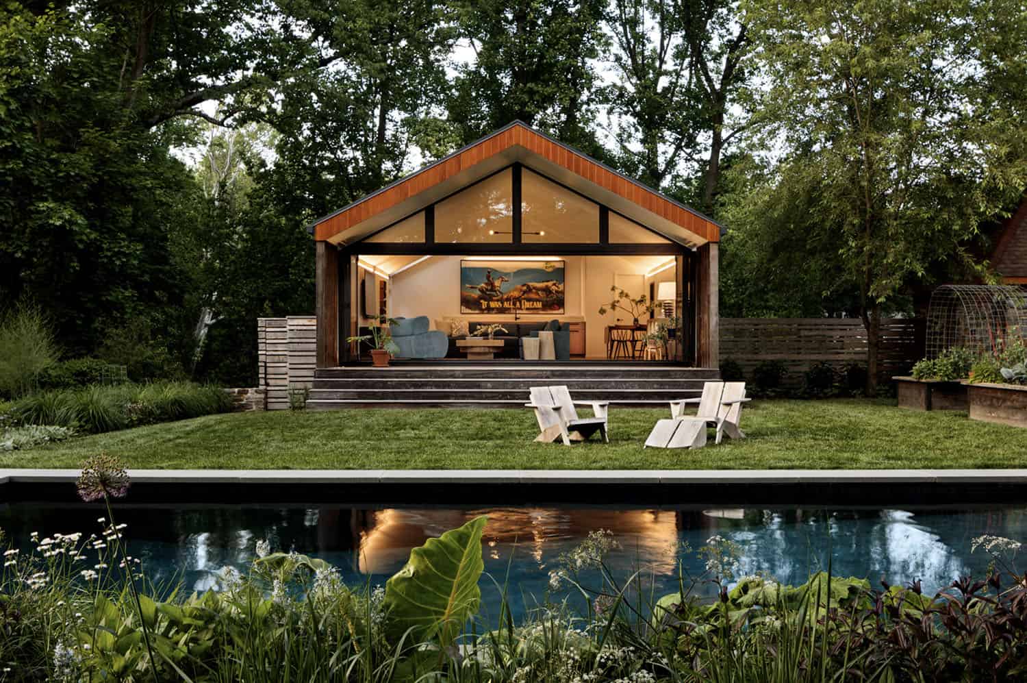 contemporary home exterior pool with a pool house