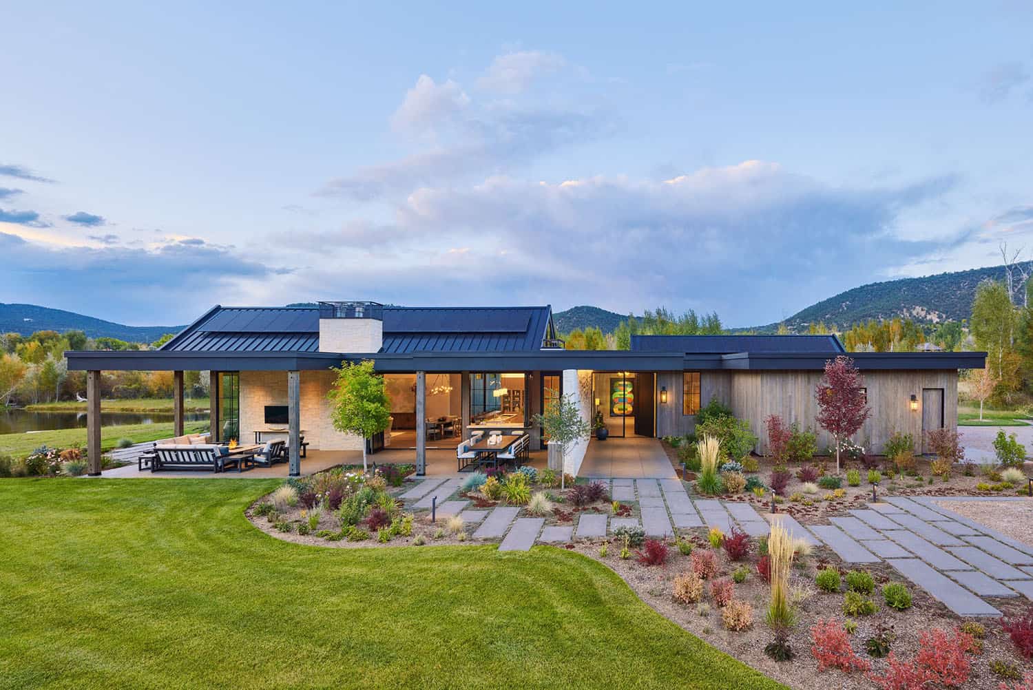 rustic modern riverfront home exterior