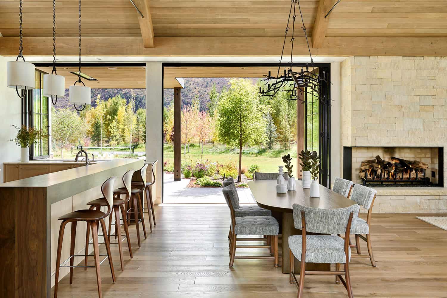rustic modern dining room and kitchen with sliding glass doors