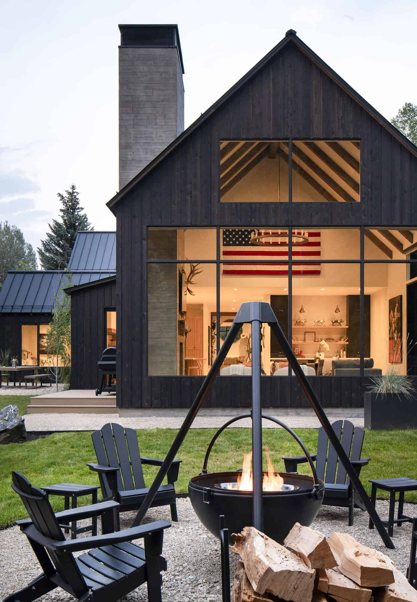 modern mountain home exterior with a fire pit