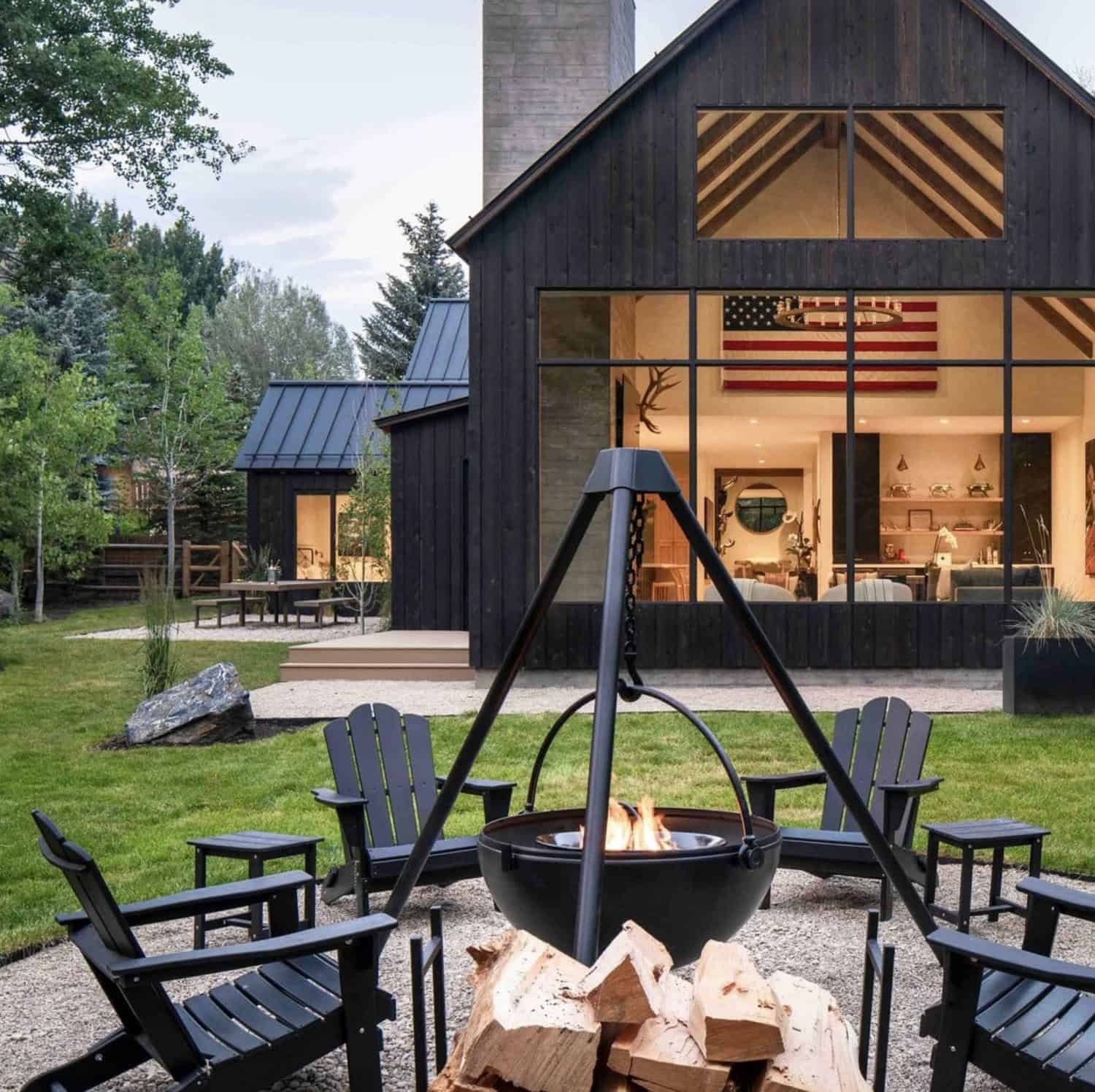 modern mountain home exterior with a fire pit