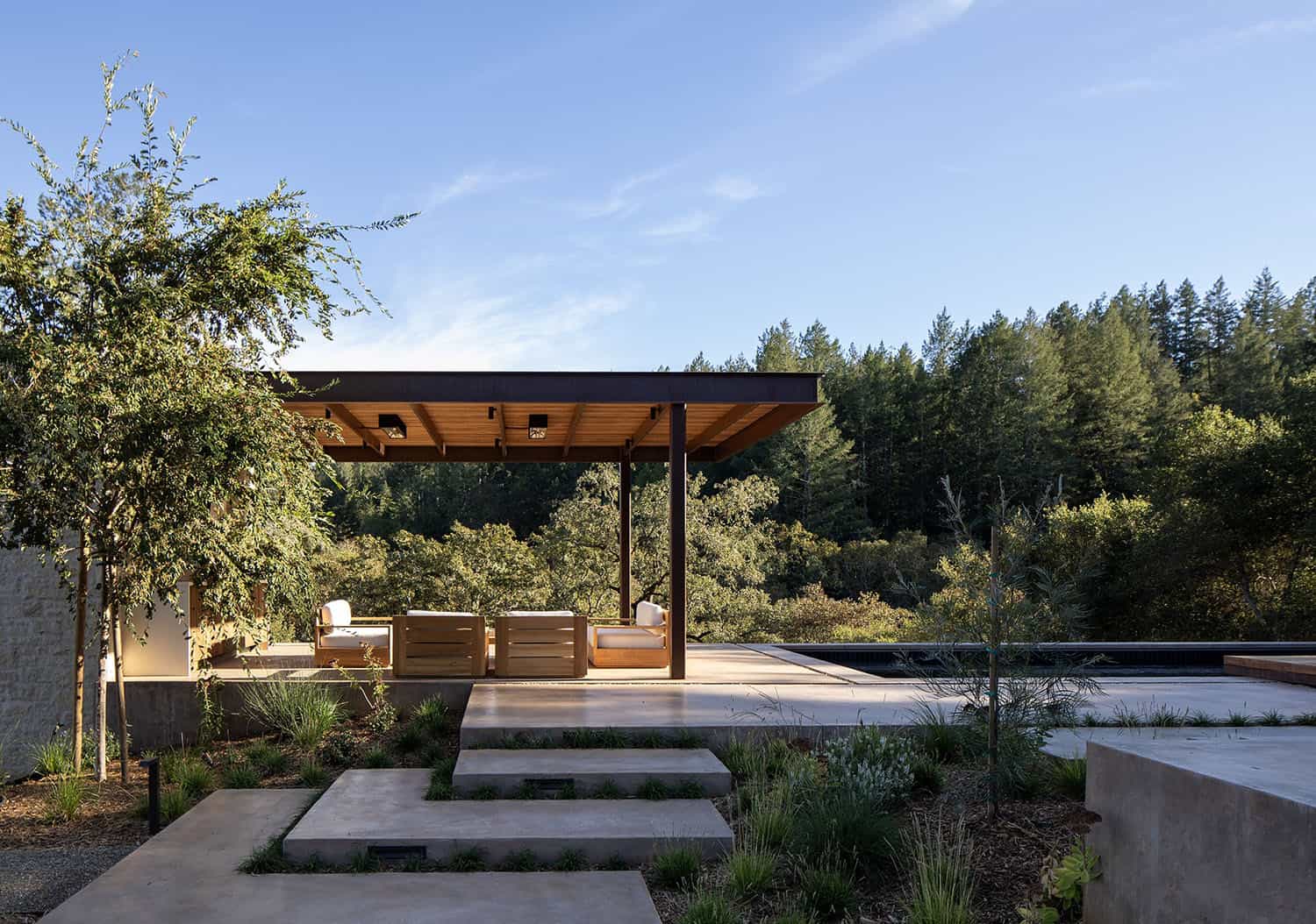 modern farmhouse exterior with a patio