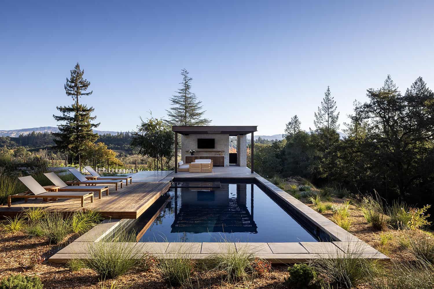 modern farmhouse exterior with a pool