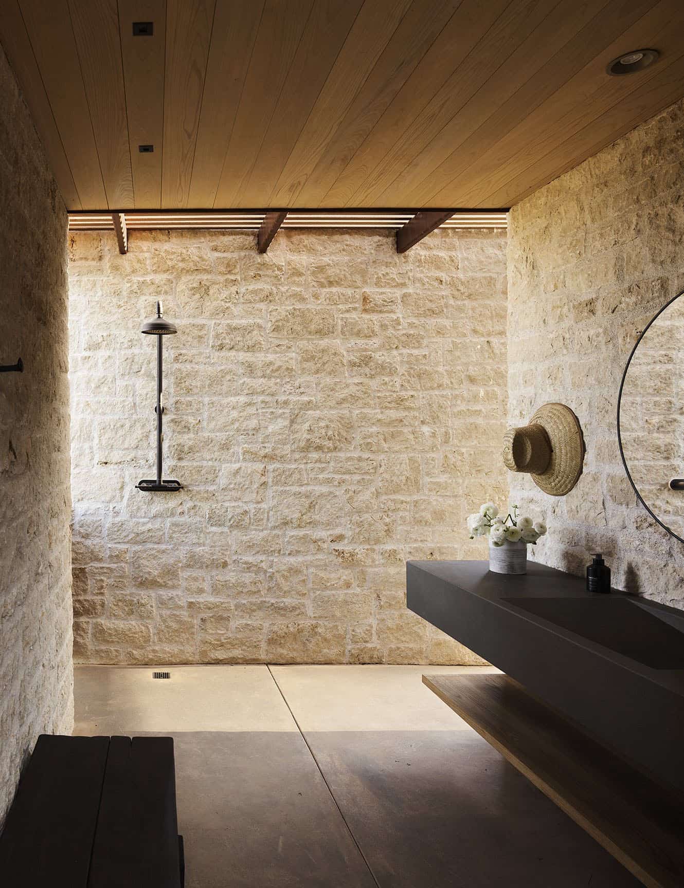 modern farmhouse pool house bathroom with a vanity and outdoor shower