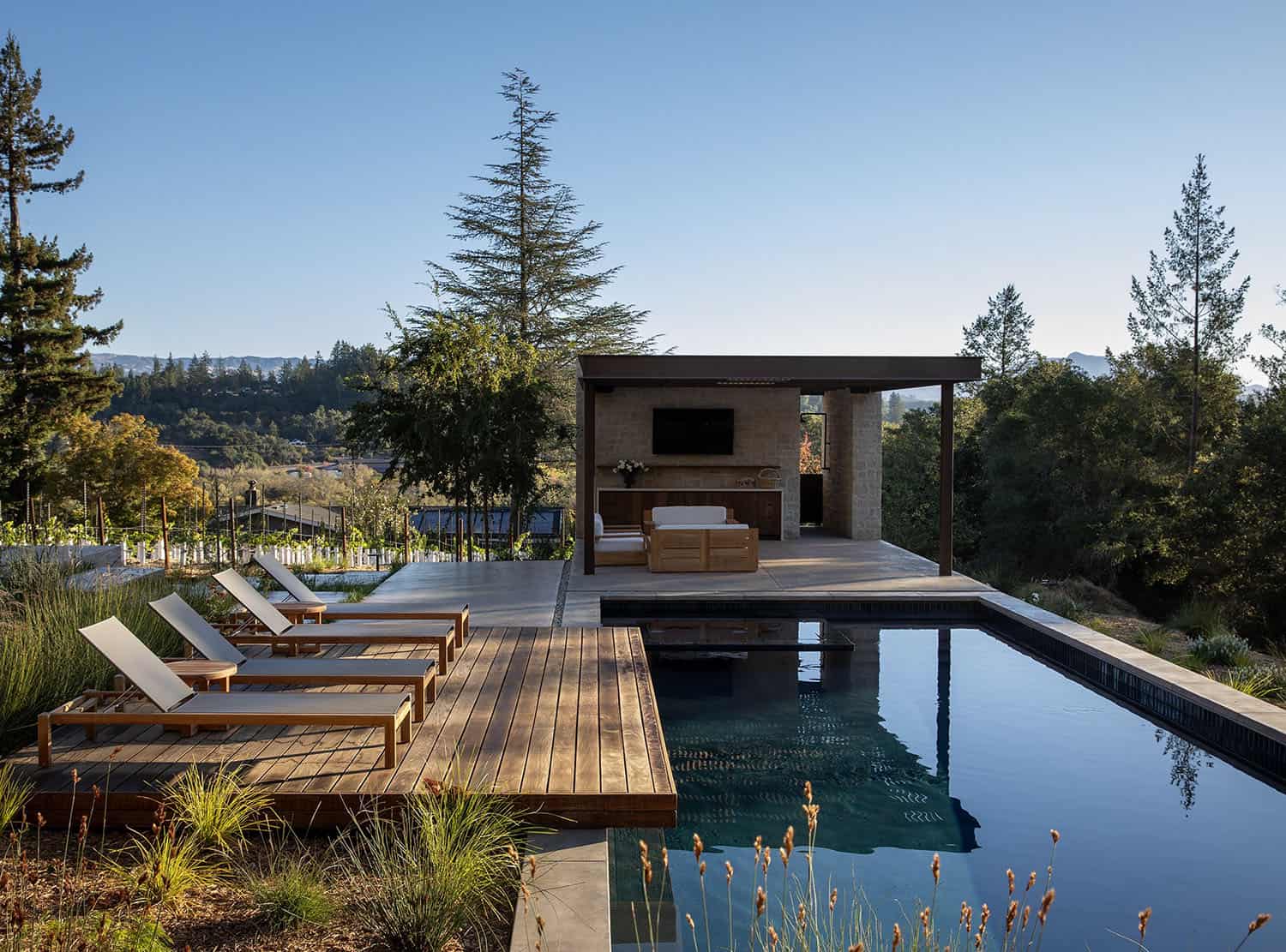 modern farmhouse home exterior with a pool