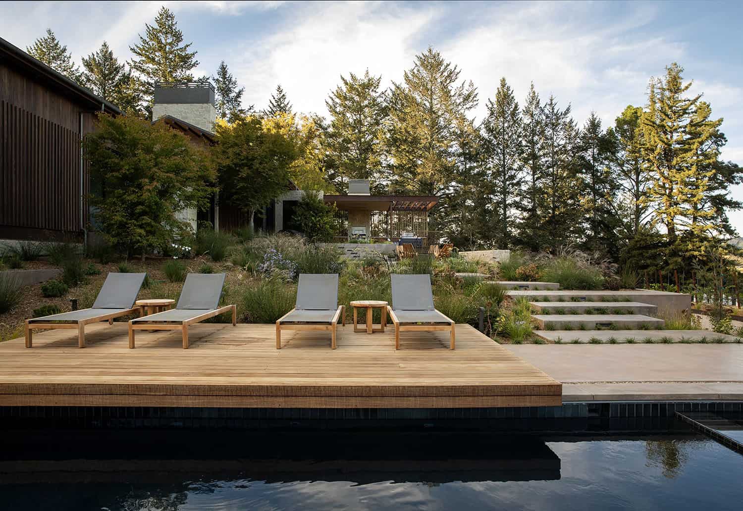 modern farmhouse home exterior with a pool