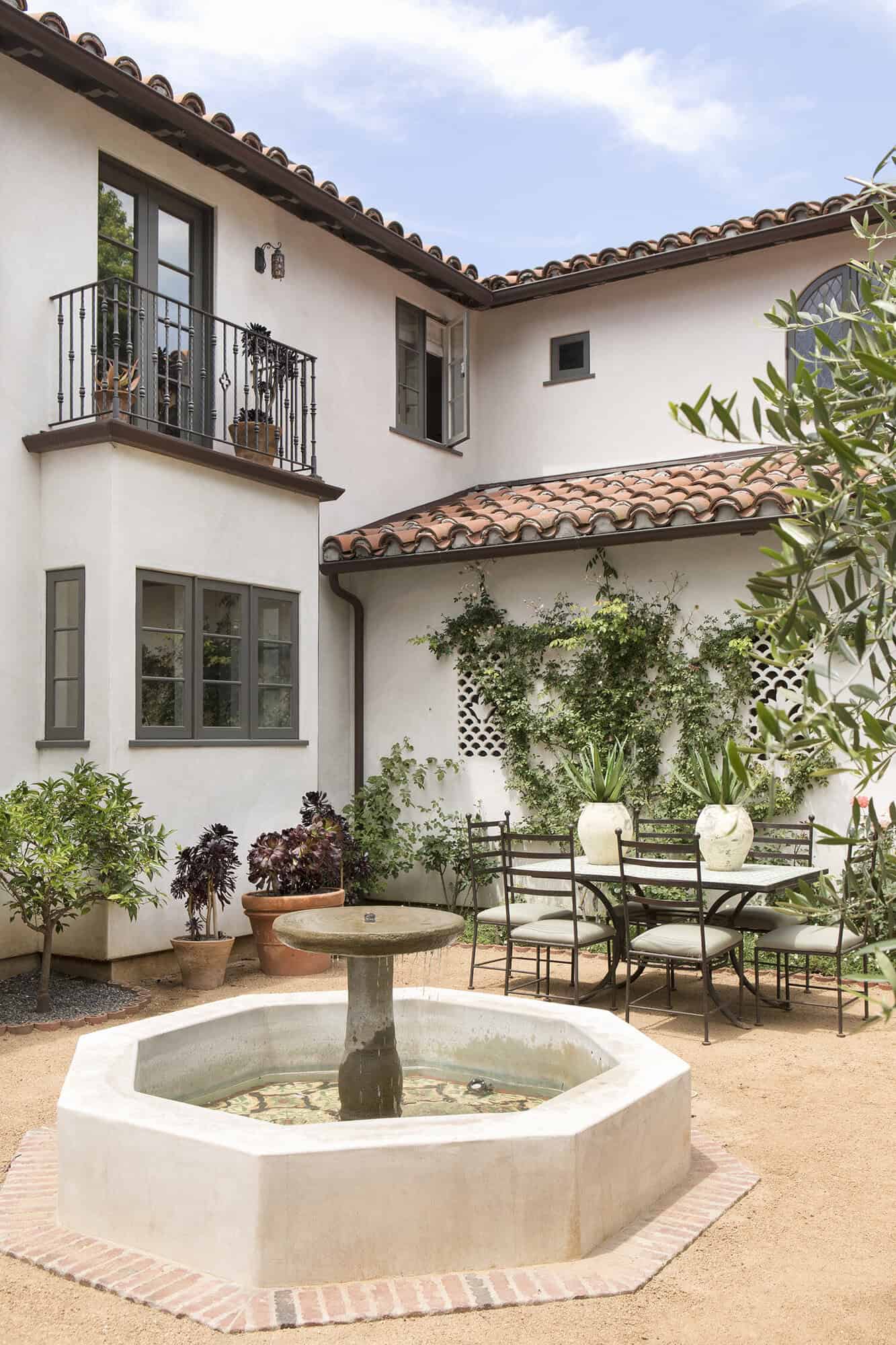 spanish colonial revival home courtyard with a water fountain