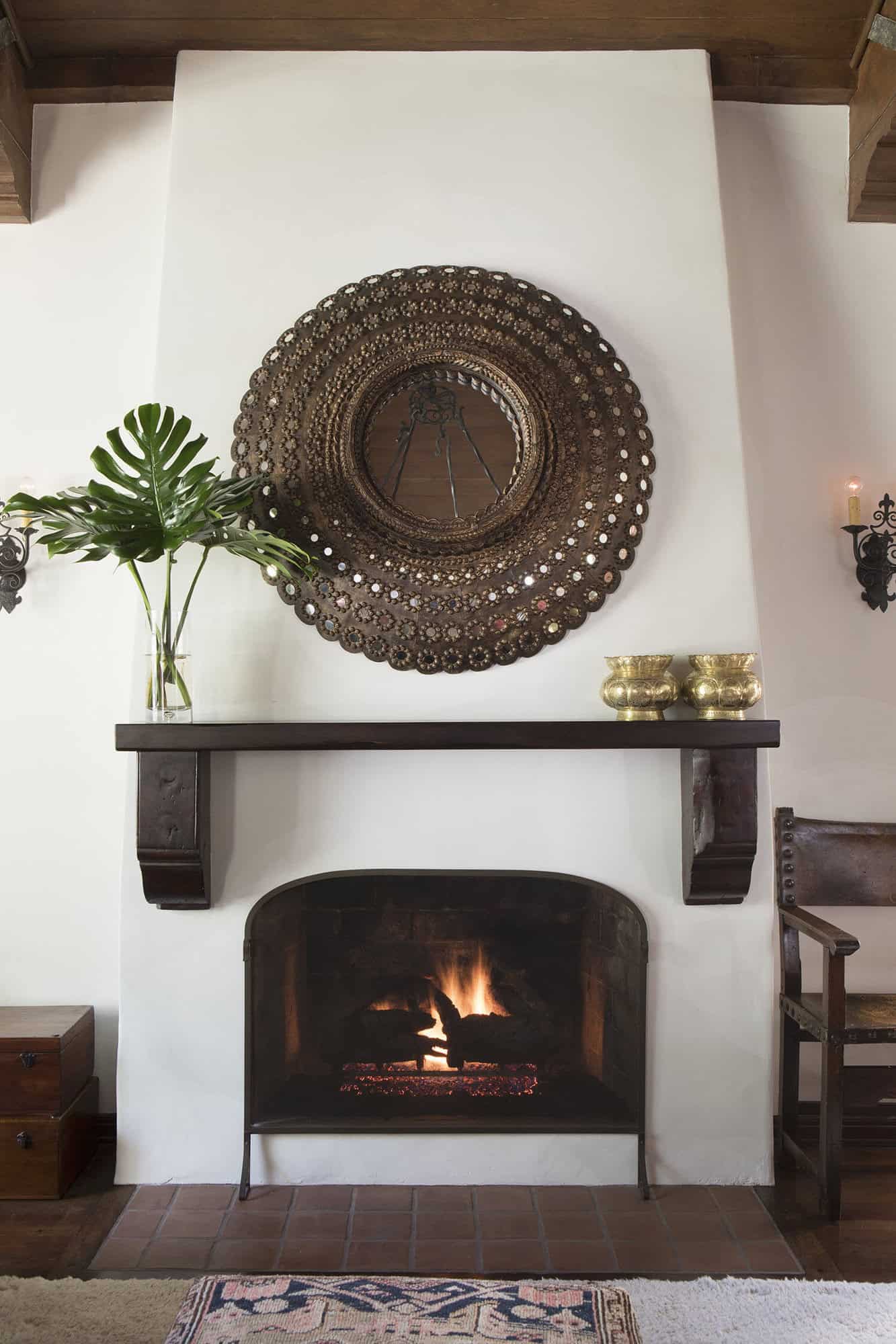 spanish colonial revival living room with a fireplace