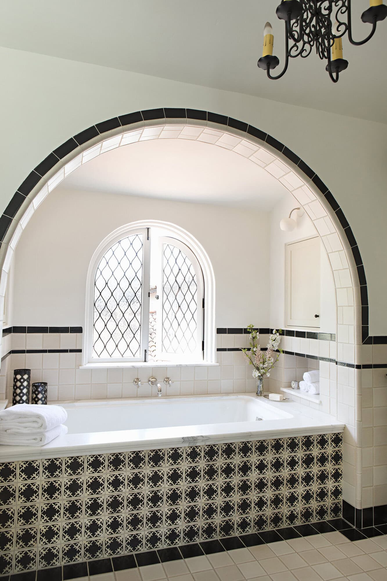 spanish colonial revival bathroom with an integrated tub