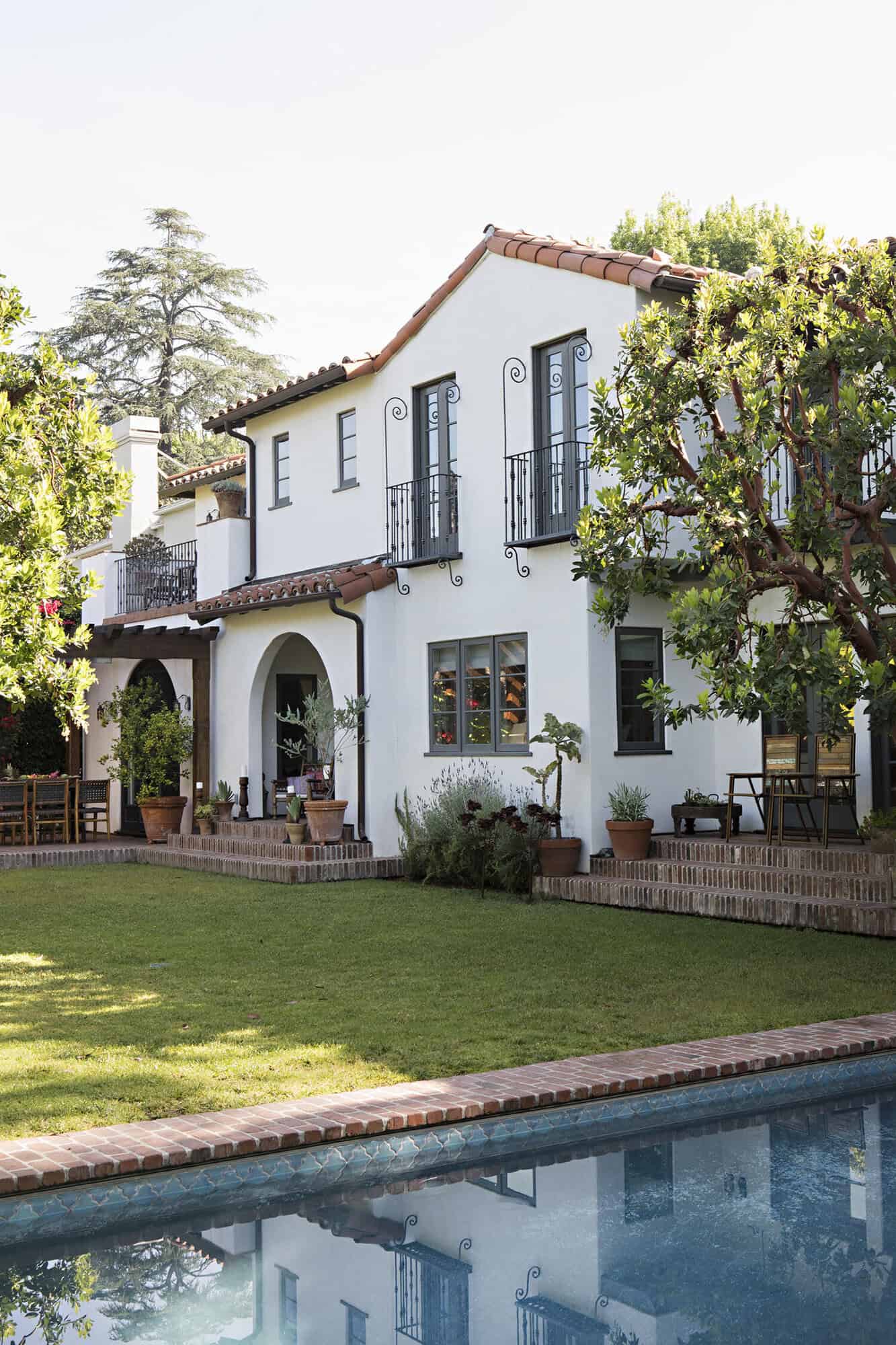 spanish colonial revival home exterior with a pool