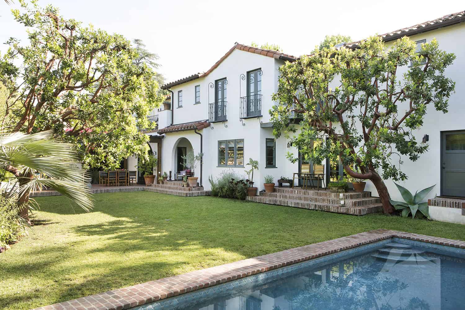 spanish colonial revival home exterior with a pool
