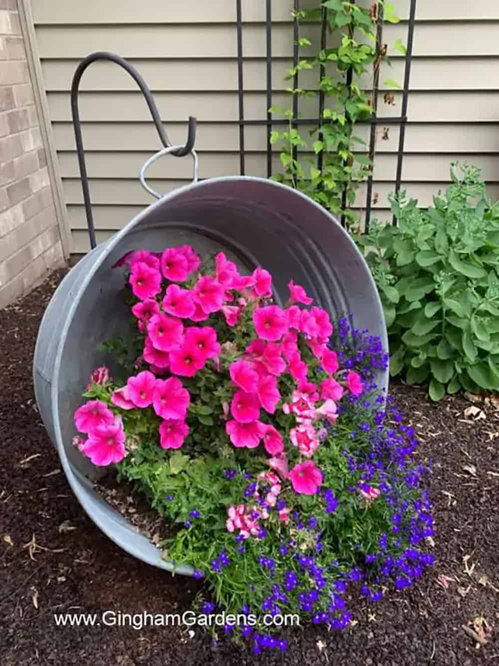 galvanized tub hanging from a shepherd's hook