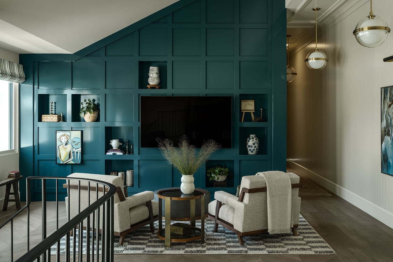 contemporary family room with a blue accent wall