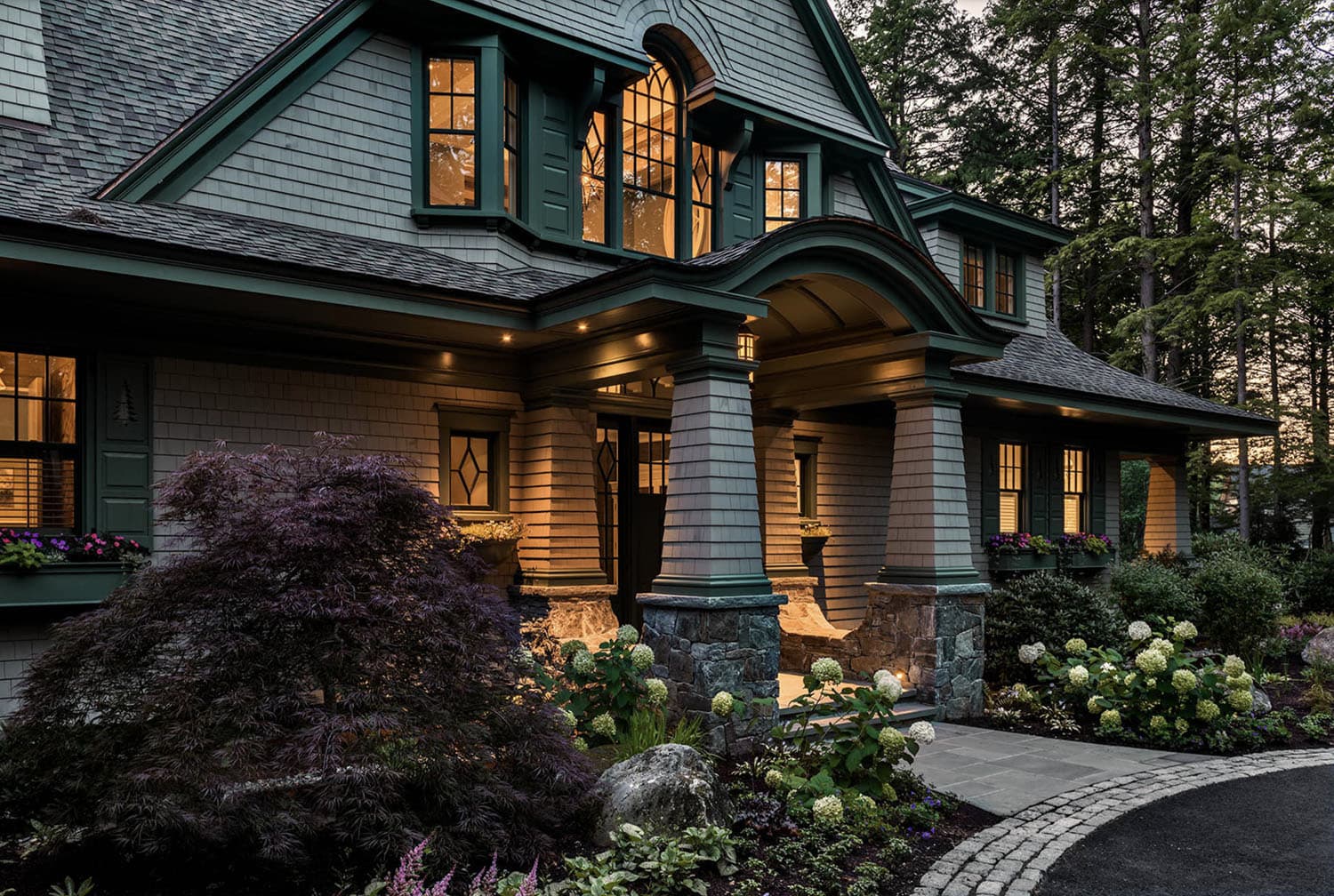 traditional style lake house exterior at dusk