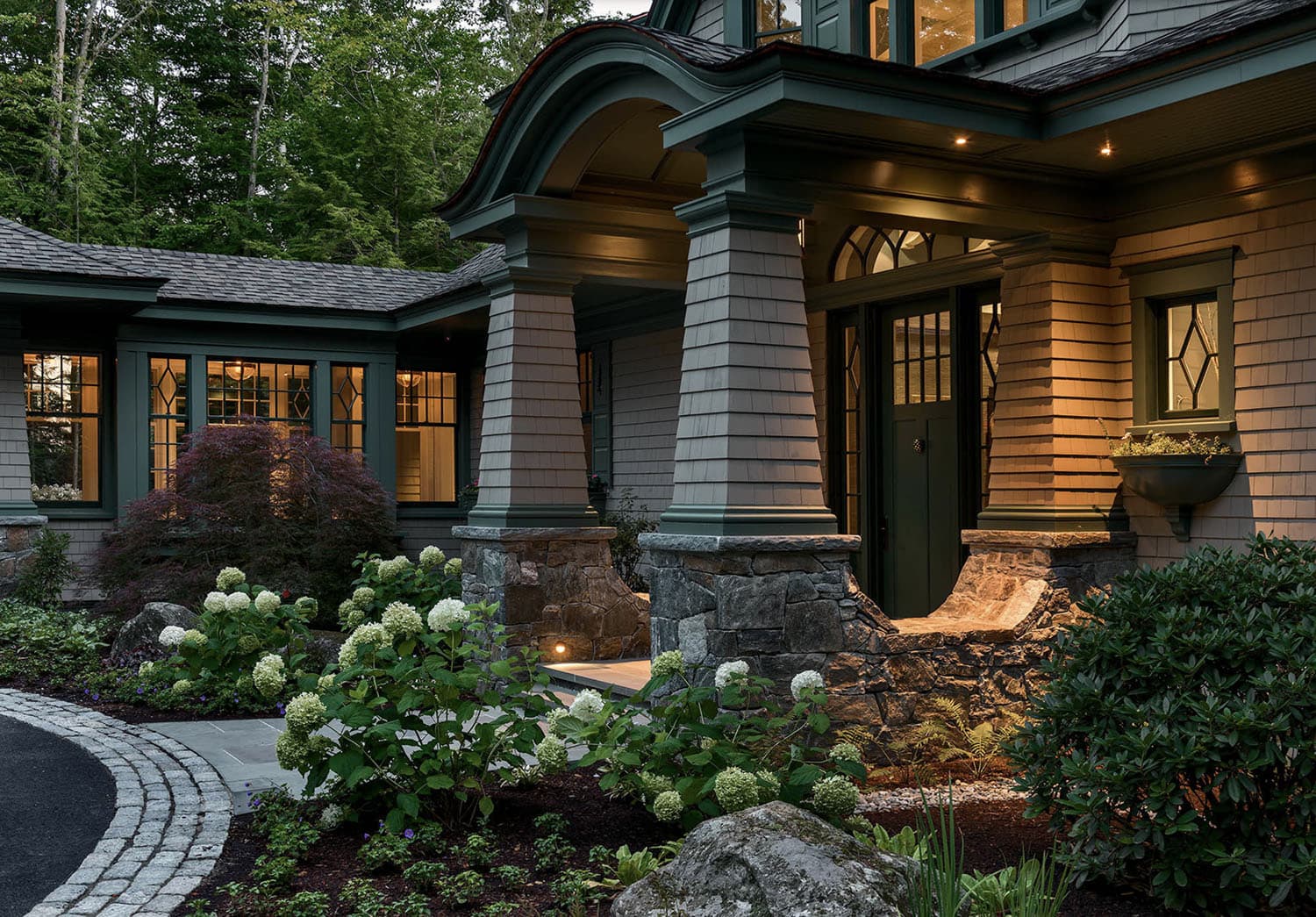 traditional style lake house exterior at dusk