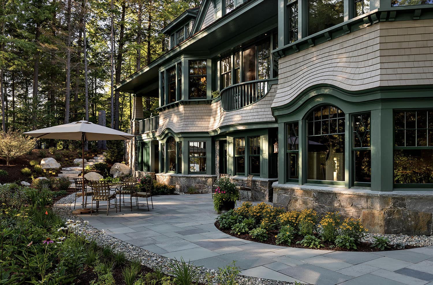 traditional style lake house exterior backyard view