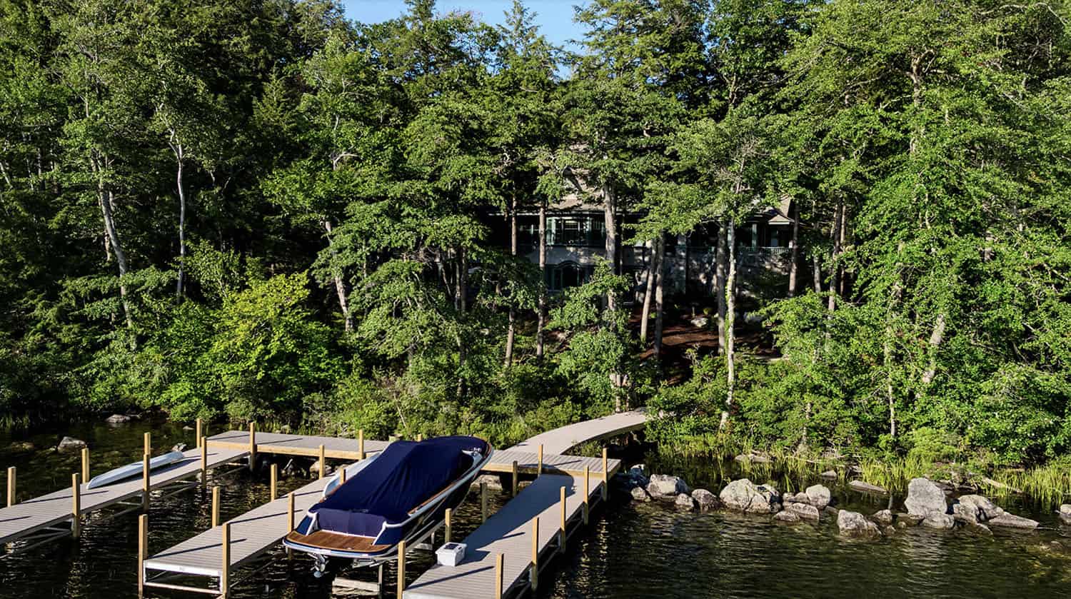 traditional style lake house exterior with a boat dock