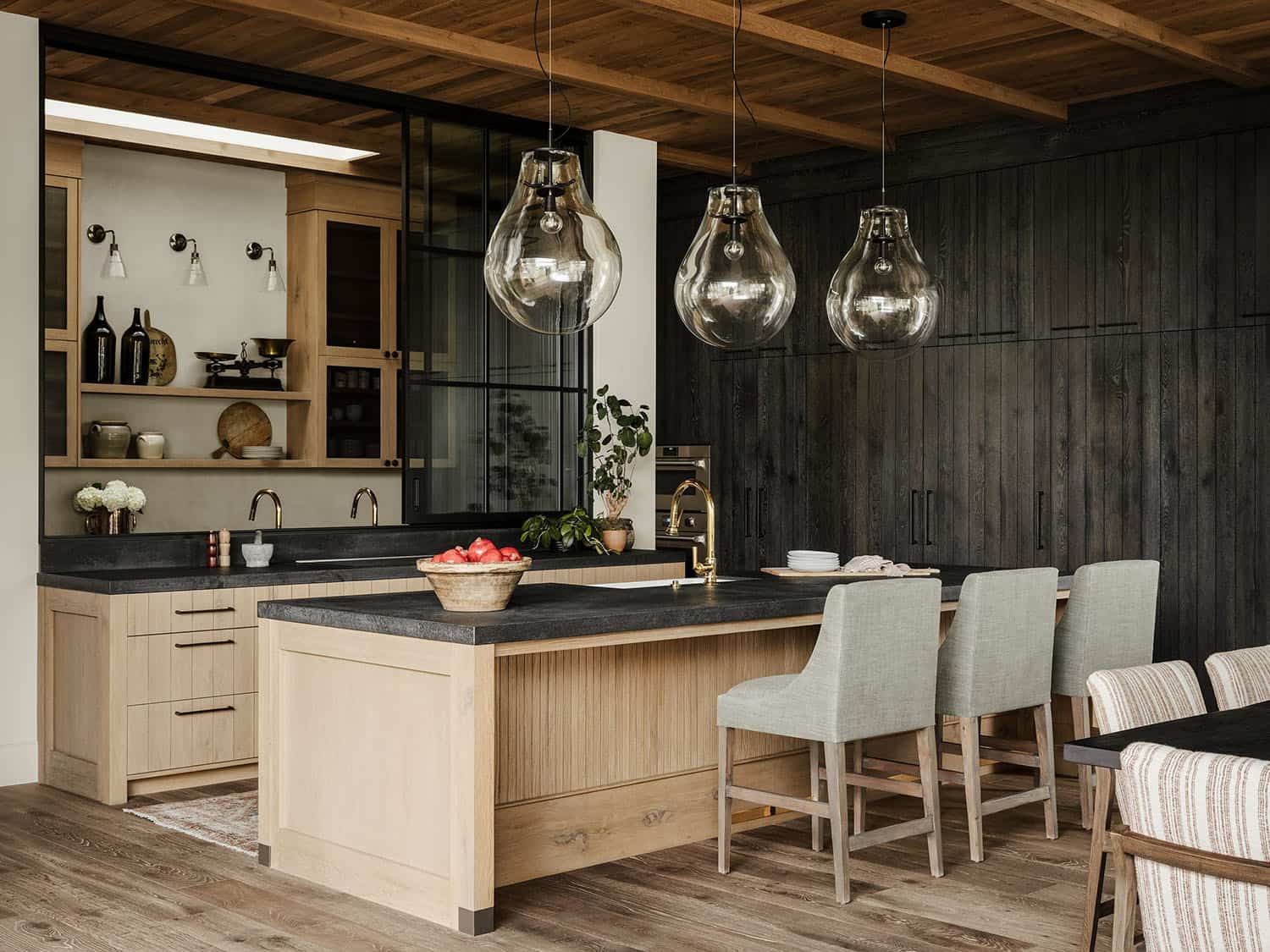 farmhouse style kitchen with large pendant lights