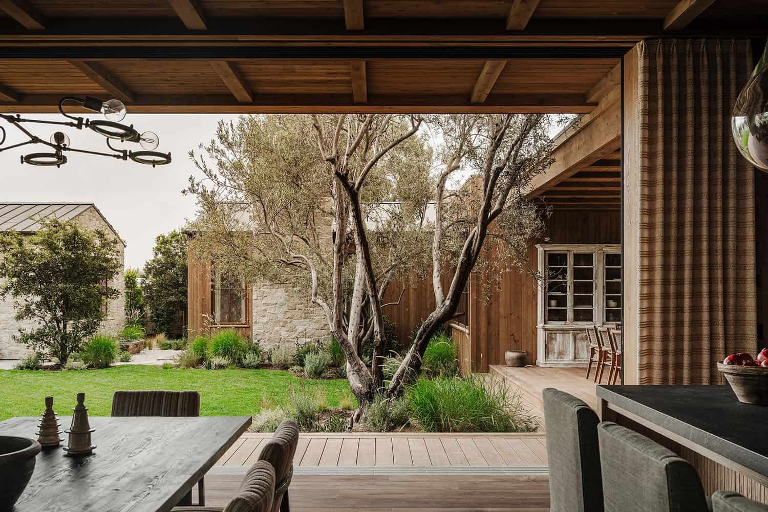 farmhouse style great room with sliding glass doors