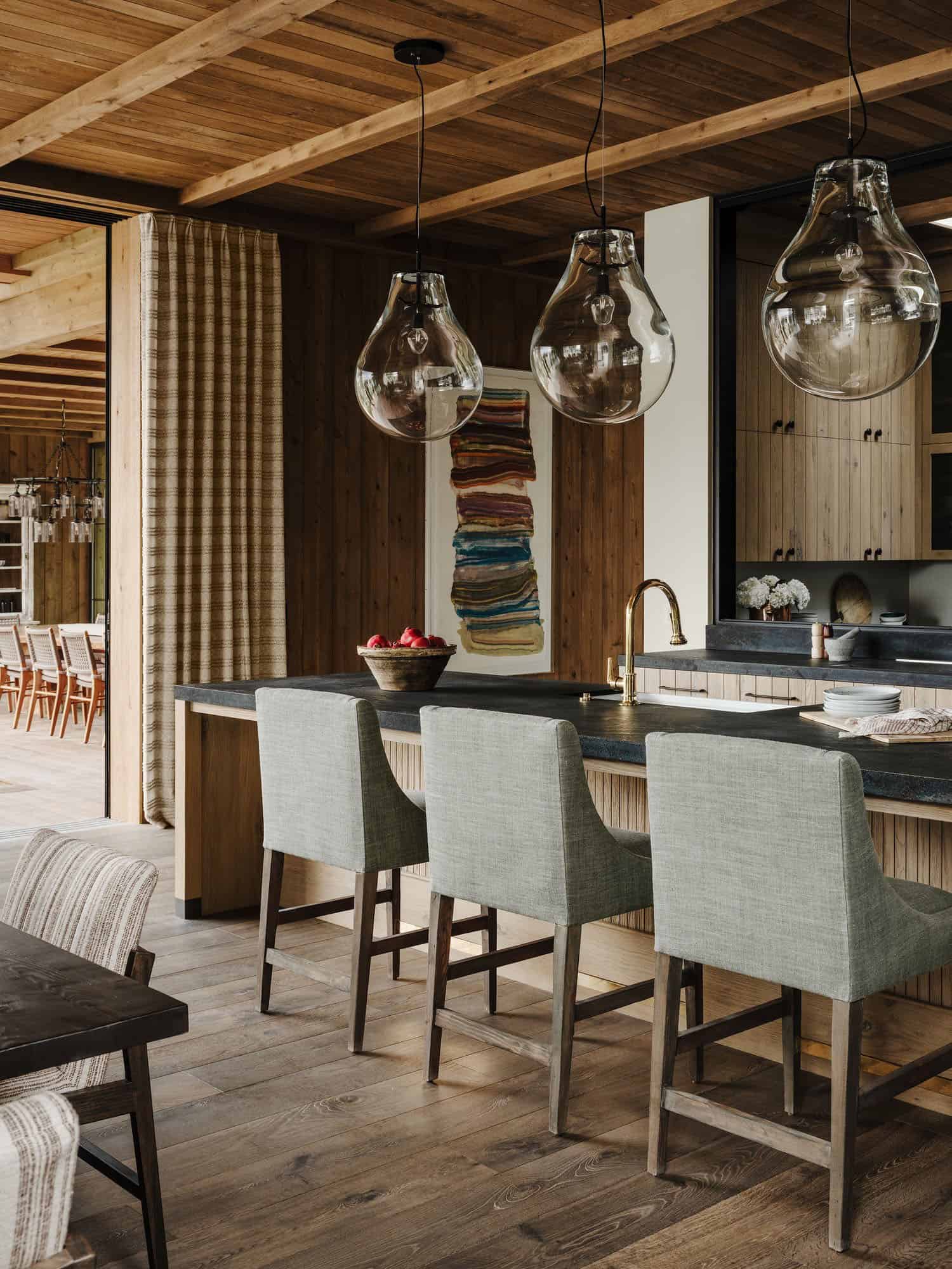 farmhouse style kitchen with large pendant lights