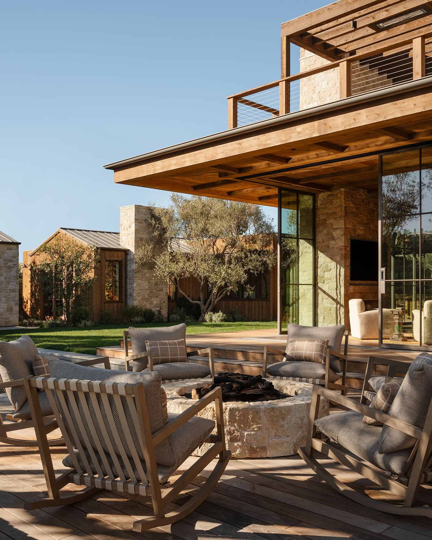 farmhouse style home exterior patio with a fire pit