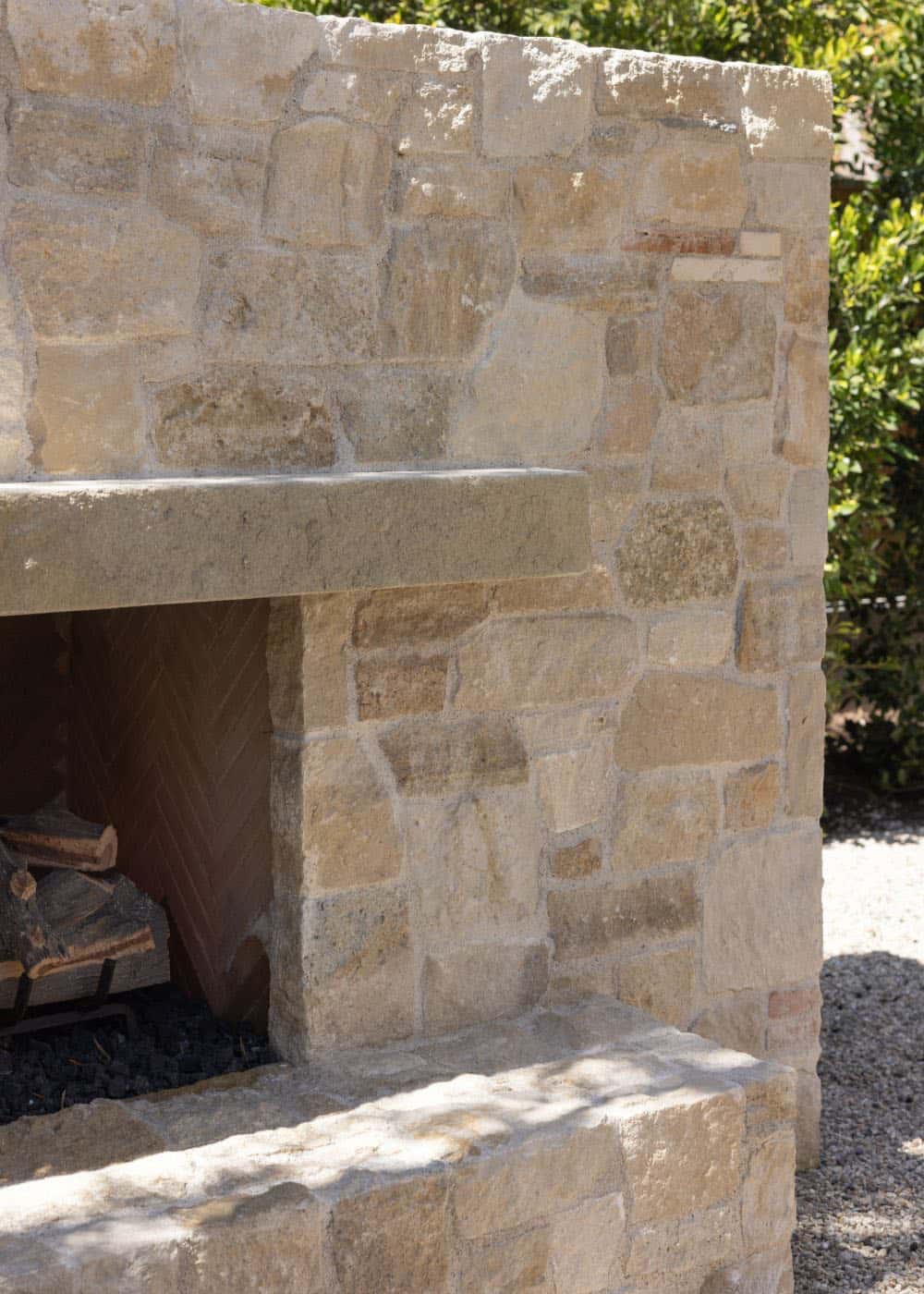 farmhouse style home exterior patio fireplace detail