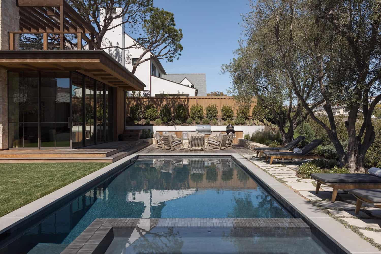 farmhouse style home exterior with a pool
