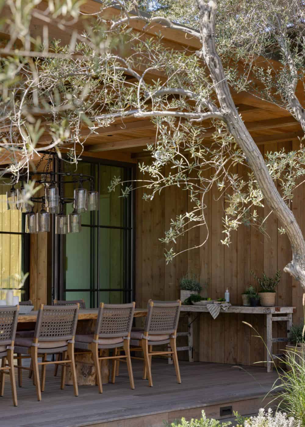 farmhouse style home exterior covered patio with alfresco dining