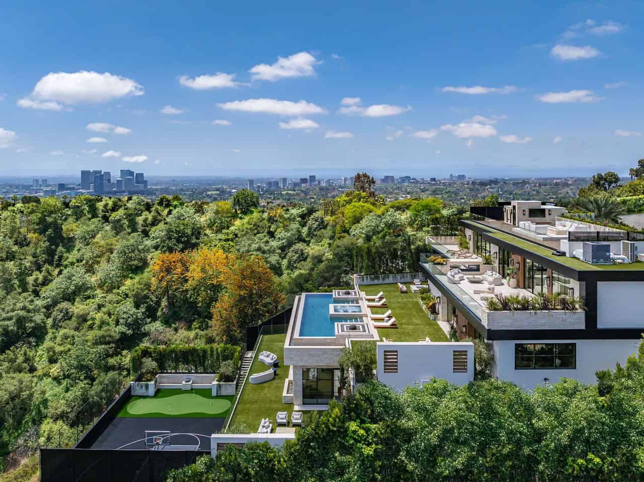 hillside home exterior with a pool